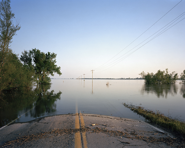 Underwater flooded road and farmland Illinois Mississippi Watershed project 