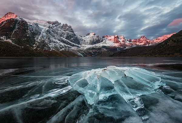 Frozen ice on a lake in Storvatnet, Nusfjord in Lofoten Islands, Northern Norway