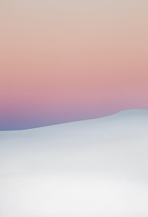 Subtle gradation between the desert sand and setting sun - sunset sky pink twilight