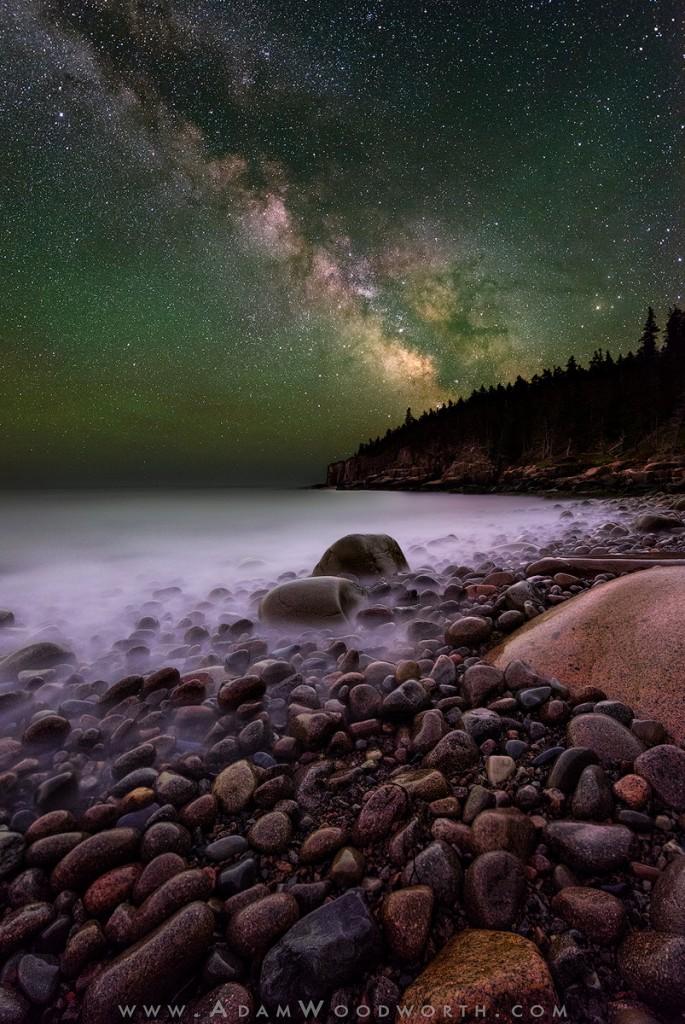 Boulder Beach & Otter Cliffs - Redux Acadia National Park, Maine I posted another version of this shot recently but I'm not happy with it anymore, so I started from scratch and re-processed it. Originally I pushed the image heavily towards blue to take out a lot of the green airglow color out of the sky, but this time I chose to feature a more natural colored sky. I still punched it up a bit for contrast, but the green glow in the sky is real, it is from airglow, a natural phenomenon that occurs high up in the atmosphere as molecular particles emit light when they react to scattered radiation from the sun and various other chemical interactions. The sky doesn't look like this to your eye at night but the camera is capable of seeing much more light during a long exposure, so the actual colors of the sky come out in the photographs. Airglow is much more visible (to the camera) in places where the sky is very dark without light pollution, and Acadia is a great place for that! This is a blend of 5 main images, but technically 9 exposures. The sky is made up of 5 exposures at ISO 6400 f/2.8 for 10 seconds each, which are then stacked with Starry Landscape Stacker (available for Mac only, but you can do this in Photoshop) to achieve pinpoint stars and lower noise than a single ISO 3200 shot for 25 seconds would have yielded. The foreground is from 4 other exposures, 3 at ISO 3200 f/2.8 for 5 minutes each, and 1 at ISO 1600 f/2.8 for 10 minutes. The foreground exposures are taken at different focus distances so that I can get the entire scene in focus after blending them together. Doing it with multiple exposures instead of a single exposure at f/8 or f/11 means the exposures take less time and and I can re-take one more easily if there was a mistake, and I can capture water movement in a different way. All shots were at 14mm, using my Nikon 14-24mm f/2.8 lens on my Nikon D800E. You can read much more about my process in my tutorial 