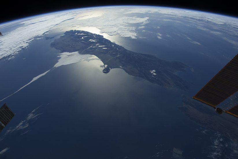 A scene from the IMAX® film "A Beautiful Planet". Over the Pacific Ocean, a spectacular view of New Zealand. © 2016 IMAX Corporation. Photo courtesy of NASA.