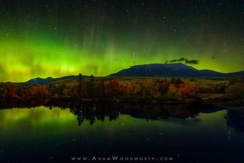 Autumn Aurora Over Mt. Katahdin Maine This is one of those shots that I've been dreaming about getting and I was lucky enough to have it all come together on Wednesday night! Matt Milone of Nightmute Photography and myself spent a few days exploring areas in and around Baxter State Park in Maine, and what a way to wrap up the trip with an amazing display of the Northern Lights! The autumn colors are finally starting to come along, and we were lucky that there was some good color along the river here, we got a break in the wind to get some nice reflections, and the sky cleared out just in time for a good flare up of the aurora. Sometimes nature brings it all together! Due to the limitations of human vision in low light we couldn't see the aurora like this with our eyes, but we could see bright areas without color, and occasionally we could see bright spikes, and for a few minutes the sky shimmered and that was amazing! The camera has no such color limitations in the dark and long exposures bring out all the detail and color. Nikon D810A, Nikon 14-24mm f/2.8 lens. This is a blend of 3 exposures, one for the sky at ISO 12,800, 6 seconds, f/2.8. One of the foreground exposures was at f/2.8, ISO 1600, for 15 minutes, and another was at f/4, ISO 1600, for 20 minutes. These foreground exposures were used to get detail in the trees and mountain. The aurora was moving so fast that I had to use a relatively quick shutter speed for the sky, 6 seconds was about as much as I could do without blurring the aurora too much and losing detail in the spikes and curtains.